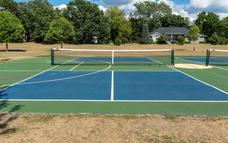 Freshly surfaced blue and green pickleball court